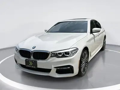 The 2018 BMW 5 Series 530e xDrive iPerformance Plug-In Hybrid, with its elegant white finish and AWD...
