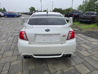 2014 Subaru WRX STI with the 6-speed manual and only 116,000kms! Vehicle comes safety certified! Two... (image 5)