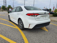 Check out this 2023 Toyota Corolla Hybrid LE CVT with 27,670 KMS, finished in a sleek White exterior... (image 4)