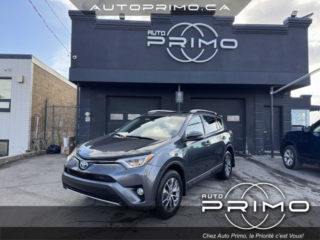 2016 Toyota RAV4 Hybride AWD Automatique avec Toit Ouvrant Camér in Cars & Trucks in Laval / North Shore