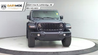 The 2025 Jeep Wrangler 4xe 4-Door Willys, in a striking gray, is a new adventure-ready 4x4 SUV that... (image 7)