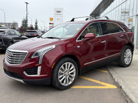The 2017 Cadillac XT5 Platinum in Red Passion Tintcoat delivers all-wheel drive performance powered... (image 3)