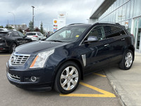 The 2015 Cadillac SRX Premium Collection, shown in Sapphire Blue Metallic, delivers confident perfor... (image 3)