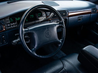 1997 Cadillac Deville White Exterior on blue Interior comes with Leather seats , Heated seats , Digi... (image 6)