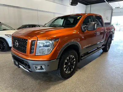 Take on your day in style with our 2019 Nissan Titan PRO-4X Crew Cab 4X4 shown off in Habanero Orang...