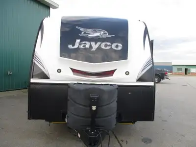 A two slide trailer with a front queen bedroom , rear side dbl bed , rear corner bath w/ skylight ov...