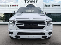Unleash the power of the 2023 Ram 1500 Sport Crew Cab. This head-turning Bright White truck boasts a... (image 9)