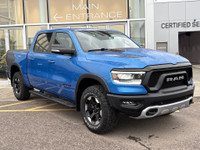 The 2022 Ram 1500 Rebel in Hydro Blue Pearl stands out with bold styling and off-road capability. Eq... (image 9)