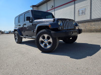 6 Speed manual transmission Jeep Sahara upgraded with Lift Kit, 33" Falken Wildpeak All Terrain tire... (image 9)