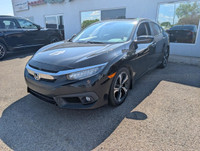 The 2016 Honda Civic Touring (VIN: 2HGFC1F9XGH111613) is a refined compact sedan that delivers a str... (image 2)