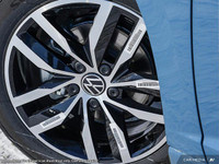 The 2025 Volkswagen Jetta Comfortline is a stunning blue sedan that offers a smooth driving experien... (image 7)