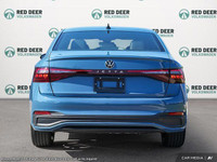 The 2025 Volkswagen Jetta Comfortline is a stunning blue sedan that offers a smooth driving experien... (image 4)