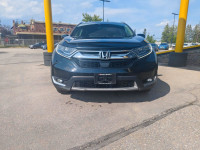 Summary The Touring represents the pinnacle of the 2019 CR-V lineup, offering a refined blend of per... (image 4)