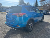 The 2017 Toyota RAV4 Hybrid XLE in a stunning blue finish offers exceptional control with its AWD dr... (image 4)