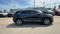 This Cadillac XT5 is equipped with: Leather Seating Surfaces w/Mini Perforated Inserts, Power moonro... (image 5)