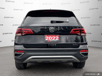 Command attention with the 2022 Volkswagen Taos Highline SUV. This sleek black beauty boasts a panor... (image 5)