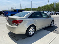 The 2014 Chevrolet Cruze 1LS offers a practical and efficient driving experience in a compact sedan.... (image 7)