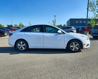 KBB.com 10 Best Sedans Under $25,000. This Chevrolet Cruze boasts a Turbocharged Gas I4 1.4L/83 engi... (image 5)