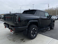 Introducing the 2024 GMC HUMMER EV 3X Pickup, a revolutionary electric truck that combines cutting-e... (image 8)