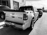Can't decide between an SUV and a truck? You don't have to! This *2010 Ford Explorer Sport Trac Adre... (image 3)