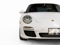 The 2009 Porsche 911 Carrera is a true masterpiece of performance and luxury, blending iconic style... (image 7)