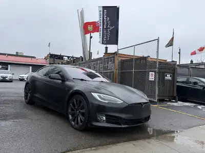 This sleek 2018 Tesla Model S in black is a stylish and eco-friendly choice for your next ride. With...