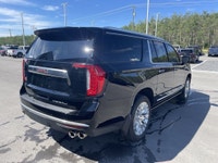 The 2023 GMC Yukon XL Denali is a full-size SUV that redefines luxury and capability, offering an ex... (image 8)