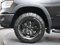 The 2021 Ram 1500 Rebel is a bold, off-road-focused full-size truck with a 5.7L HEMI V8 producing 39... (image 3)