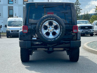 This 2018 Jeep Wrangler Sahara has a Black Exterior and Black Interior with seating for 5. Equipped... (image 4)