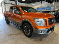 Take on your day in style with our 2019 Nissan Titan PRO-4X Crew Cab 4X4 shown off in Habanero Orang... (image 6)