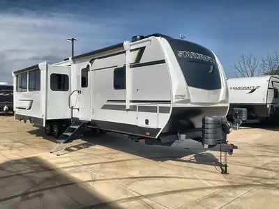 NEW FLOORPLAN! ULTIMATE FAMILY TRAILER!Key Features:Dual Opposing Slides: Create a spacious and invi...