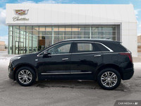 The 2023 Cadillac XT5 includes a hands-free liftgate, panoramic roof, heated front seats, and leathe... (image 1)