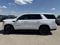 Roll out in style with this elegant and robust 2023 GMC Yukon SLT, showcasing a luxurious White Fros... (image 4)