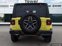Turn heads and conquer any terrain in this vibrant 2024 Jeep Wrangler Sahara, boasting a striking Hi... (image 5)