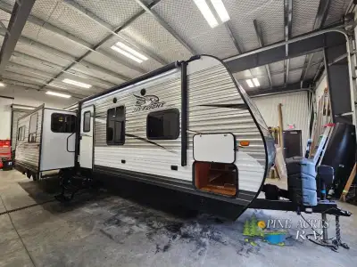 The 33RLDS Jay Flight travel trailer by Jayco offers triple slides and a rear entertainment center.A...