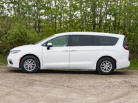 The *2023 Chrysler Pacifica Touring L* is a front-wheel-drive minivan designed for family comfort an... (image 4)