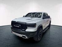 The 2022 Ram 1500 Rebel 4x4 Crew Cab 57 Box in stunning white lets you command every road with confi... (image 8)
