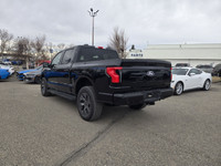 This brand new AGATE BLACK METALLIC 2025 FORD F-150 LIGHTNING FLASH is powered by an ELECTRIC ENGINE... (image 6)