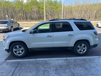 The 2016 GMC Acadia SLE is a versatile and family-friendly SUV, presented in a clean Summit White ex... (image 3)