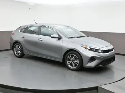 Experience refined performance and modern comfort with the 2024 Kia Forte 5 EXâ€”a sleek, sporty hat...