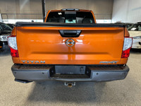 Take on your day in style with our 2019 Nissan Titan PRO-4X Crew Cab 4X4 shown off in Habanero Orang... (image 3)