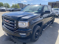 Poised for performance and utility, the 2018 GMC Sierra 1500 SLT stands proudly with a sleek Onyx Bl... (image 3)