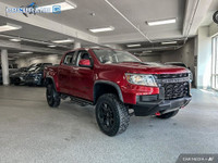 Get behind the wheel in our used 2021 Chevrolet Colorado ZR2 Crew Cab short box 4X4 in Cherry Red Ti... (image 6)