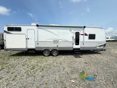 The 2012 Open Range Mesa Ridge 325B is a travel trailer with a specific floor plan (325B) within the...