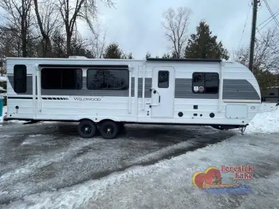 Forest River Wildwood travel trailer 27RE highlights: Dual Opposing Slides Two Lounge Chairs Firepla...