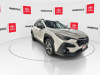 The 2024 Subaru Crosstrek Touring, particularly for the Canadian market, is a popular compact SUV th... (image 1)