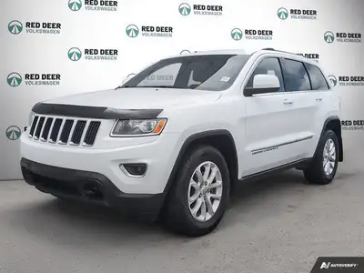 Get behind the wheel of the 2015 Jeep Grand Cherokee Laredo 4 4 in an elegant white finish, perfect...