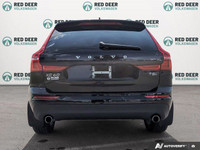 The 2021 Volvo XC60 T5 AWD Momentum is a sophisticated black SUV that offers an impeccable balance o... (image 5)