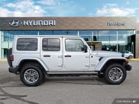 This 2023 Jeep Wrangler Sahara, a head-turner in Silver Zynith, offers both rugged capability and re... (image 5)
