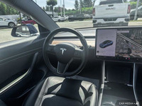 This Tesla Model 3 delivers a Electric engine powering this Automatic transmission. Window Grid Ante... (image 8)